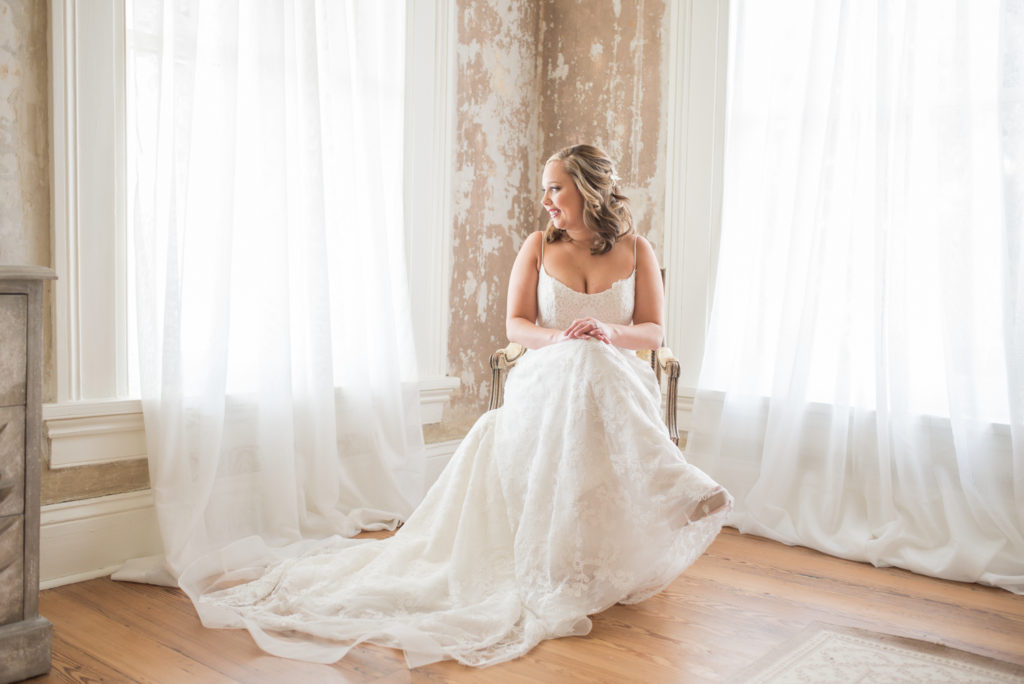 illges house wedding, bride sitting in chair by window