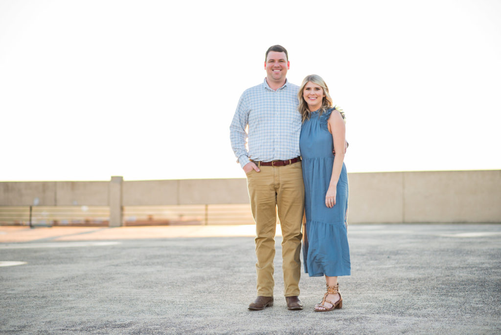 Columbus, Ga Engagement Photographer - Couple on top of rooftop at sunset