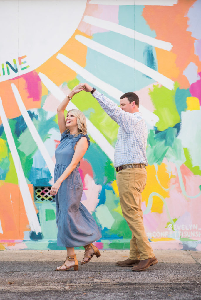 Columbus, Ga Engagement Photographer - couple in front of colorful mural
