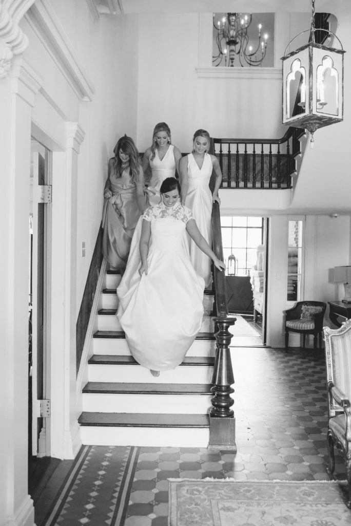 big eddy club wedding, luxury wedding photographer, bride and sisters walking down staircase