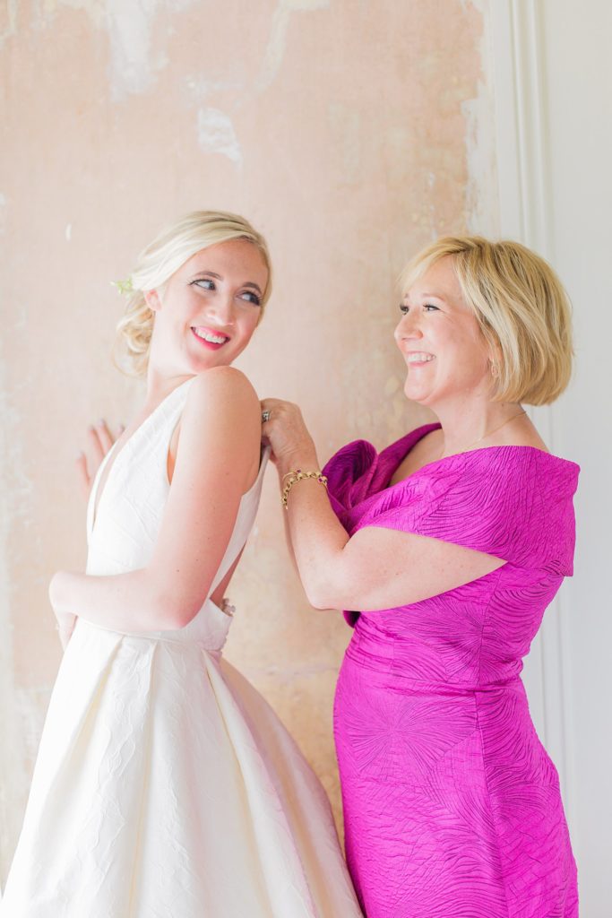 Columbus, Georgia Wedding - mother helps bride button dress at The Illges House