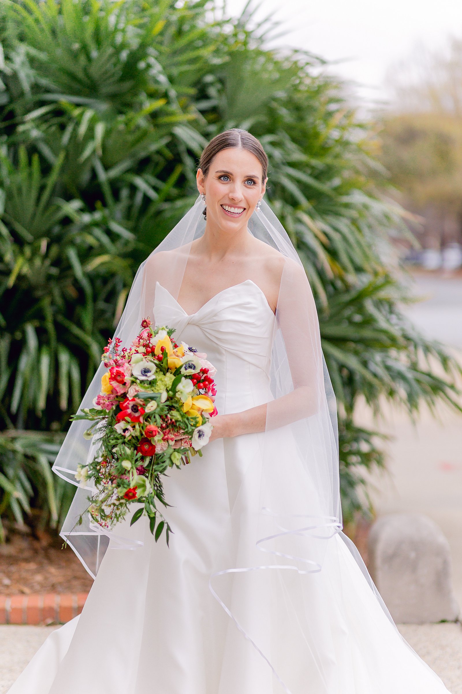 colorful winter wedding in columbus, ga - beautiful bride in anne barge gown with colorful winter bouquet 